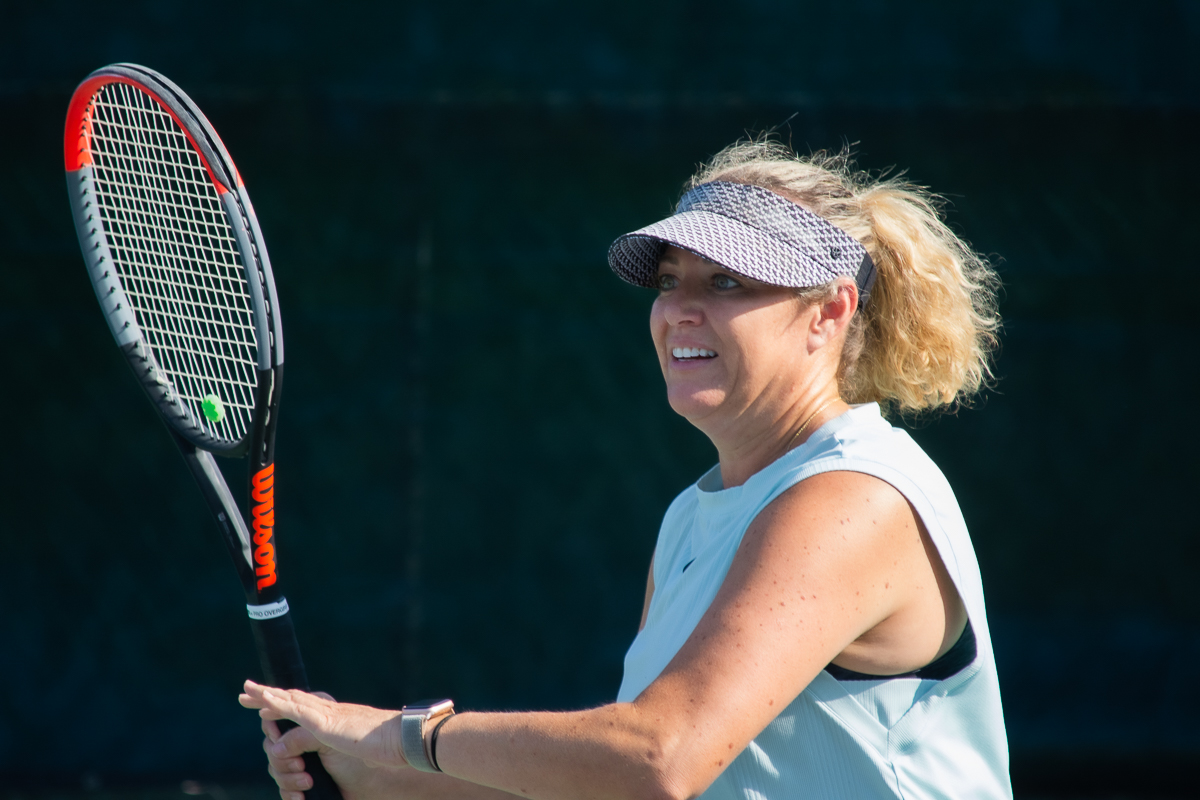 Woman playing tennis at the Salt Lake Tennis and Health Club