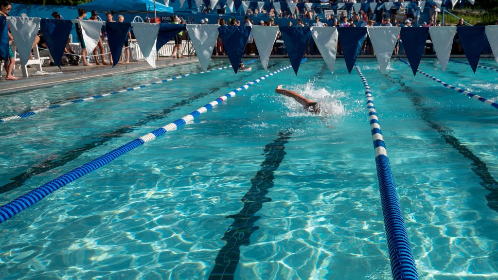 Swimmers competing at the Salt Lake Tennis and Health Club pool.