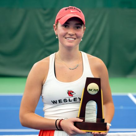 Alexandra "Rosie" Burnett holds her National Championship Trophy.