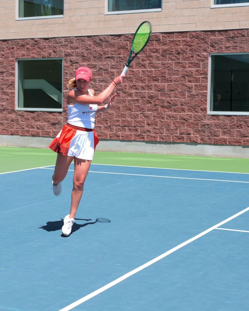 Alexandra Burnett hitting a forehand at the Salt Lake Tennis and Health Club
