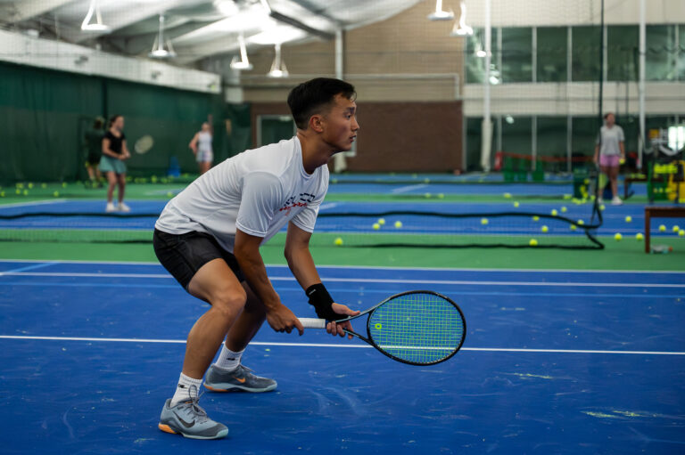 Tennis player in ready position on the indoor courts