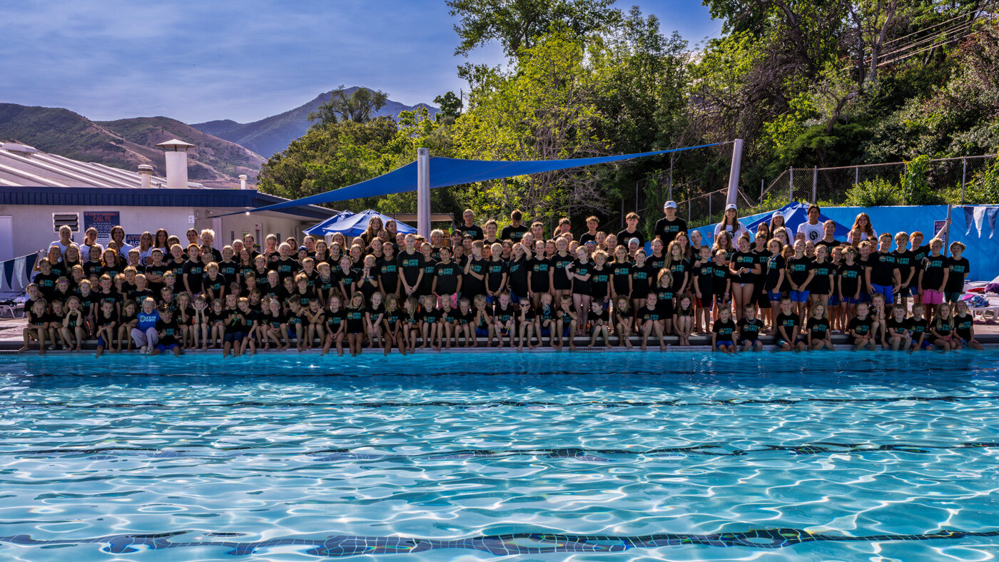 Salt Lake Tennis and Health Club swim and dive team photo on the pool deck